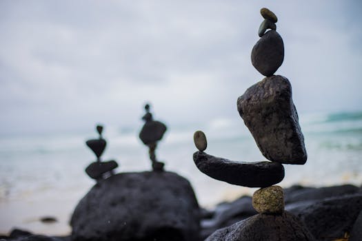 pexels photo 1051449 1051449 Artistic rock balancing on a serene beach in Fingal Head, NSW, Australia.