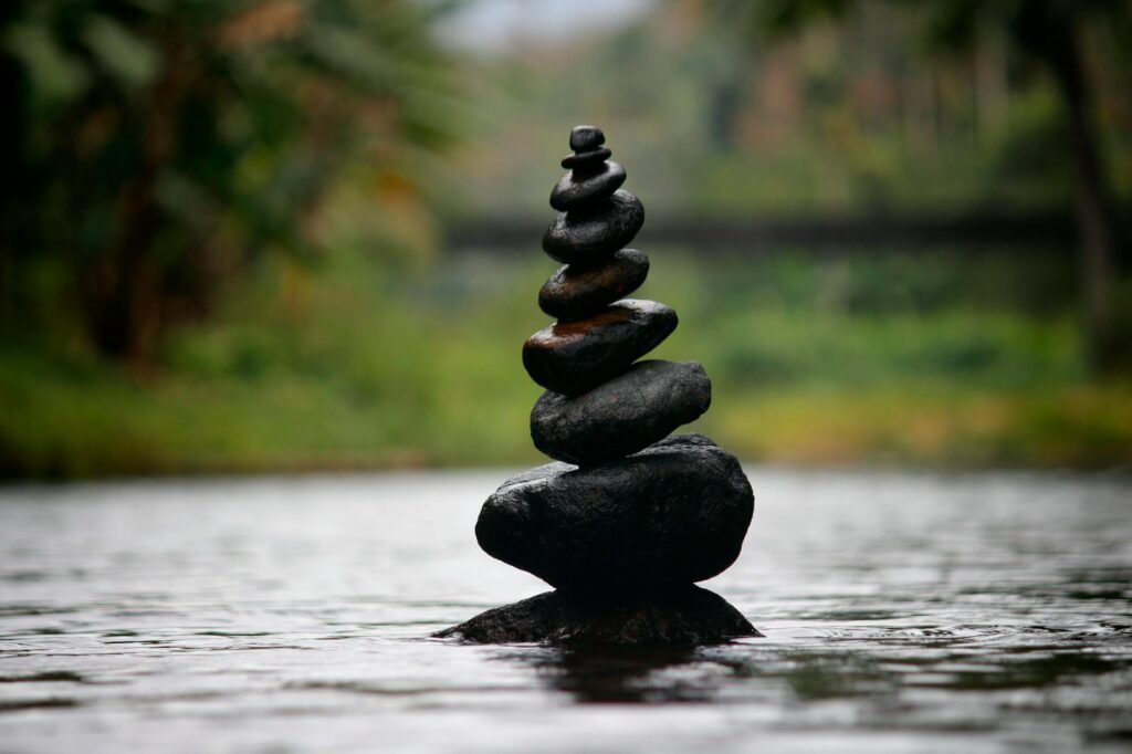 pexels photo 312839 312839 Balanced stones in a serene river evoke a sense of peace and tranquility.